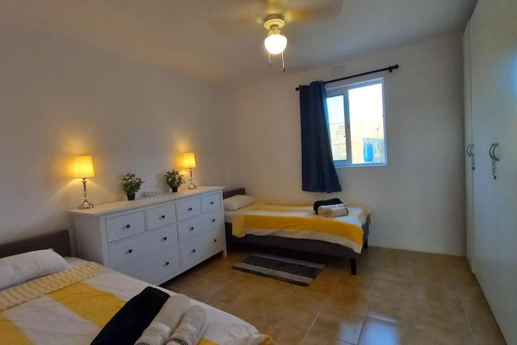 Postel nebo postele na pokoji v ubytování Sunset Suite