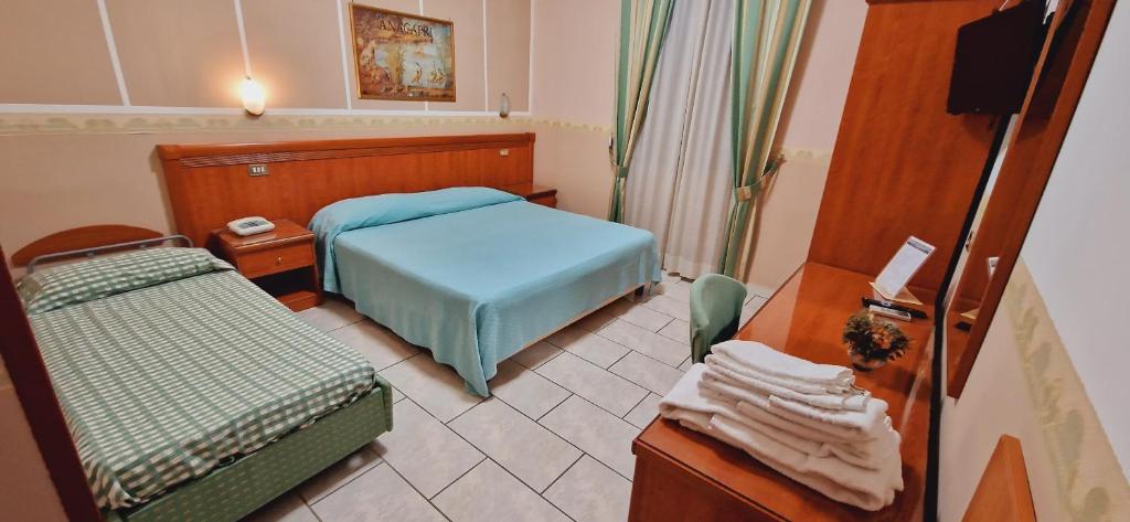 Postel nebo postele na pokoji v ubytování Hotel Lento