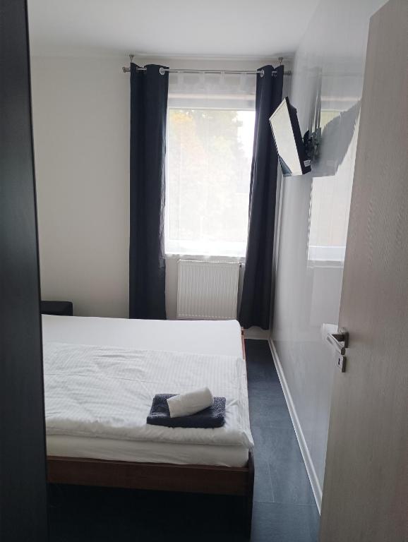 Postel nebo postele na pokoji v ubytování Apartmány u golfu