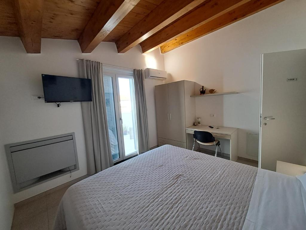 Postel nebo postele na pokoji v ubytování Tana del Riccio