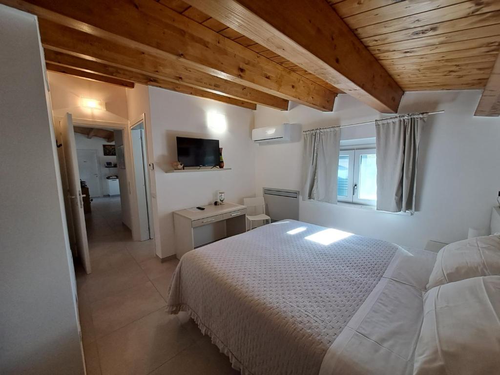 Postel nebo postele na pokoji v ubytování Tana del Riccio