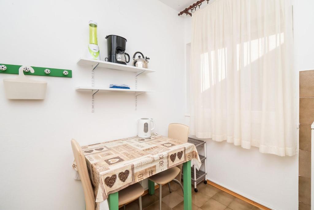 Kuchyň nebo kuchyňský kout v ubytování Apartment Neda
