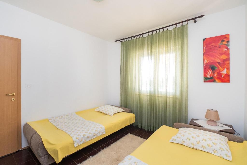 Postel nebo postele na pokoji v ubytování Apartment Neda