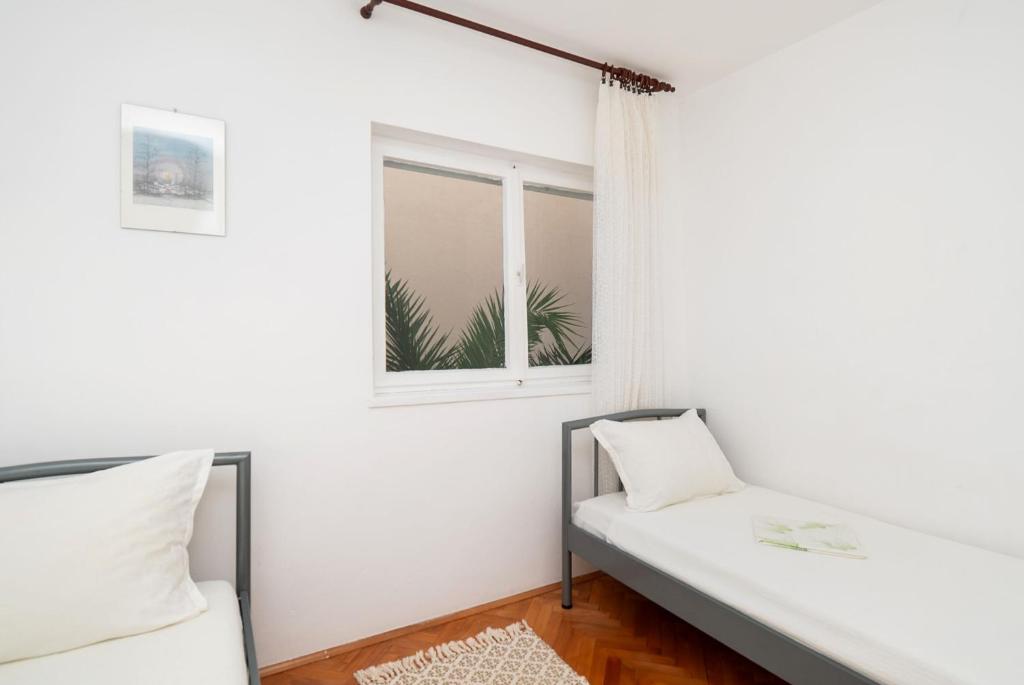 Postel nebo postele na pokoji v ubytování Apartment Neda