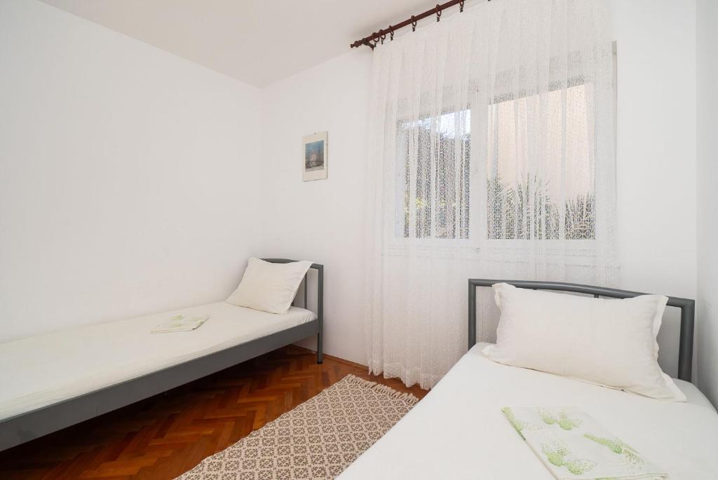 Postel nebo postele na pokoji v ubytování Apartment Neda