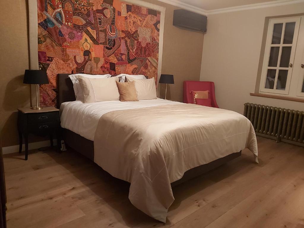 Postel nebo postele na pokoji v ubytování B&B Asmara