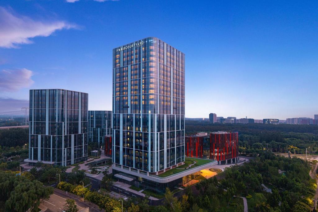 an overhead view of two tall buildings in a city at Courtyard by Marriott Beijing Changping in Beijing