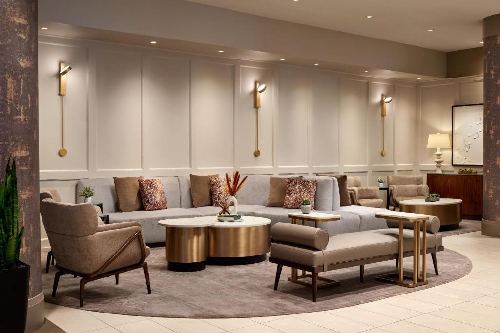 a lobby with couches and tables and chairs at Washington Marriott at Metro Center in Washington