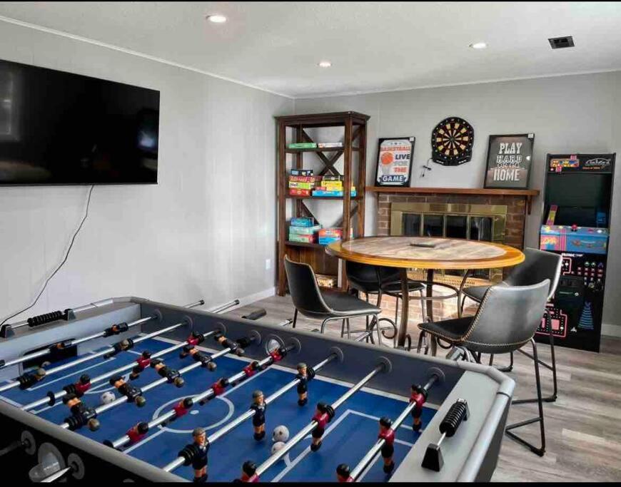 a living room with a large pool table at Spacious 4 bdr w/ Game Room 5 min Drive to College in Boulder