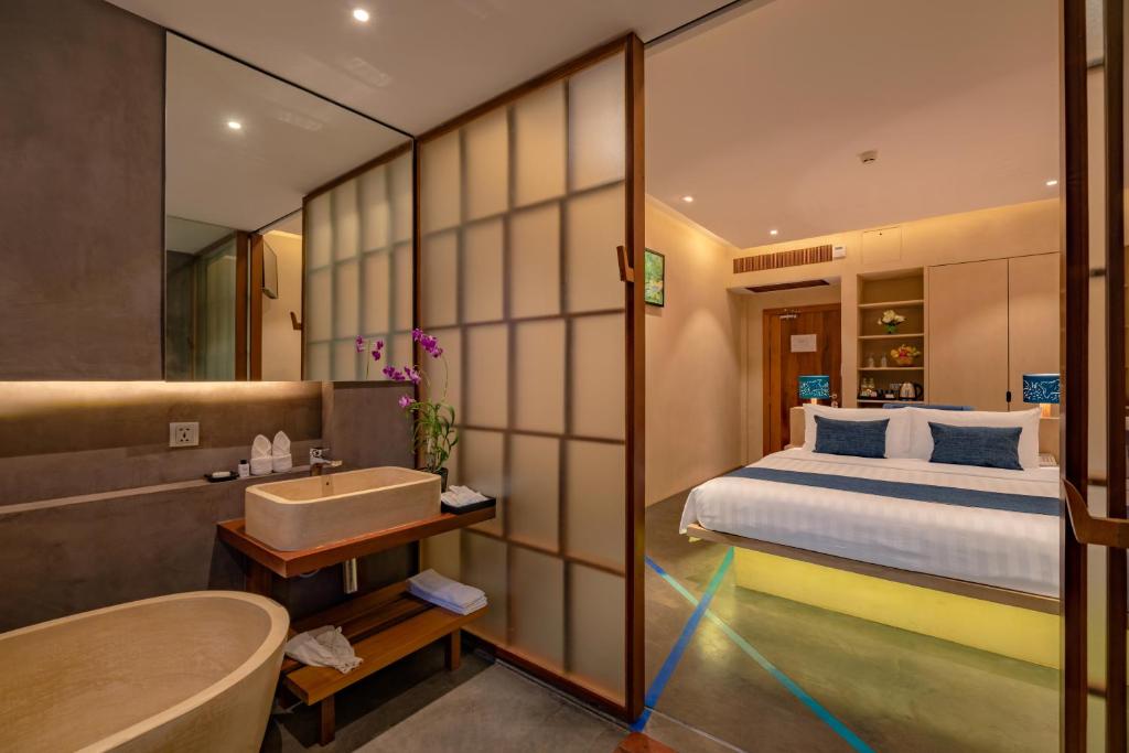 Postel nebo postele na pokoji v ubytování Sakmut Boutique Hotel