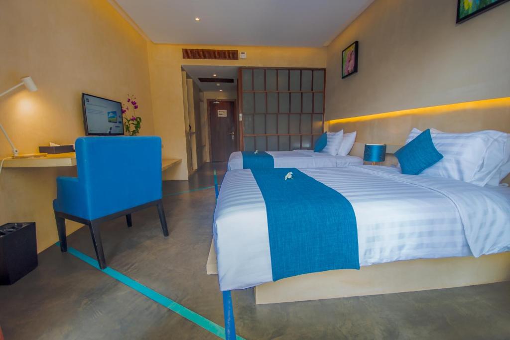 Postel nebo postele na pokoji v ubytování Sakmut Boutique Hotel