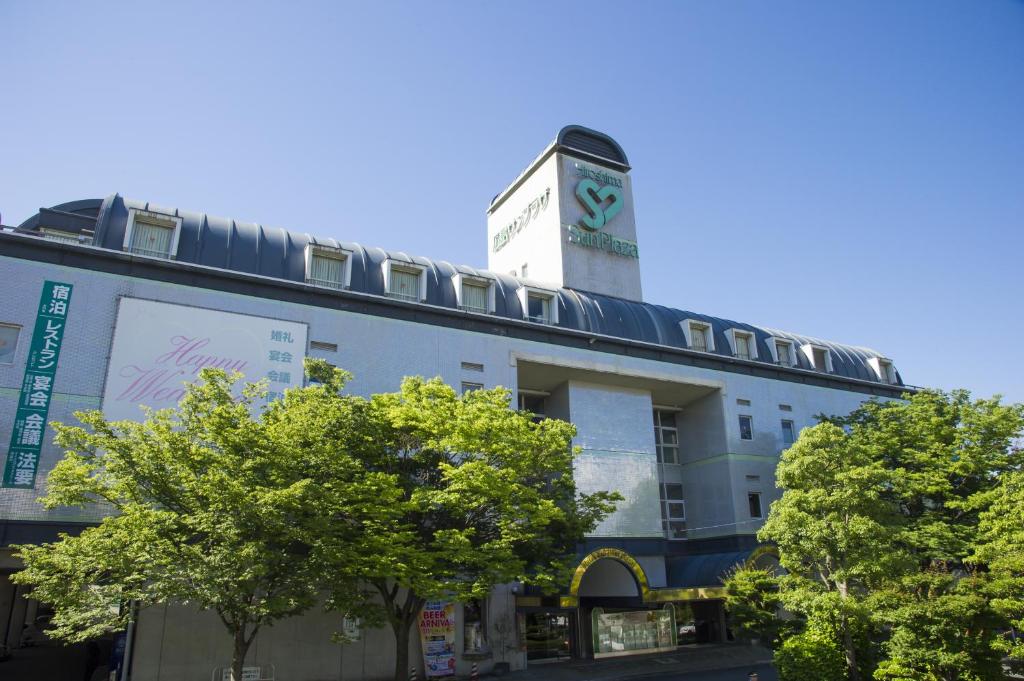a building with a clock tower on top of it at Hotel Hiroshima Sunplaza in Hiroshima