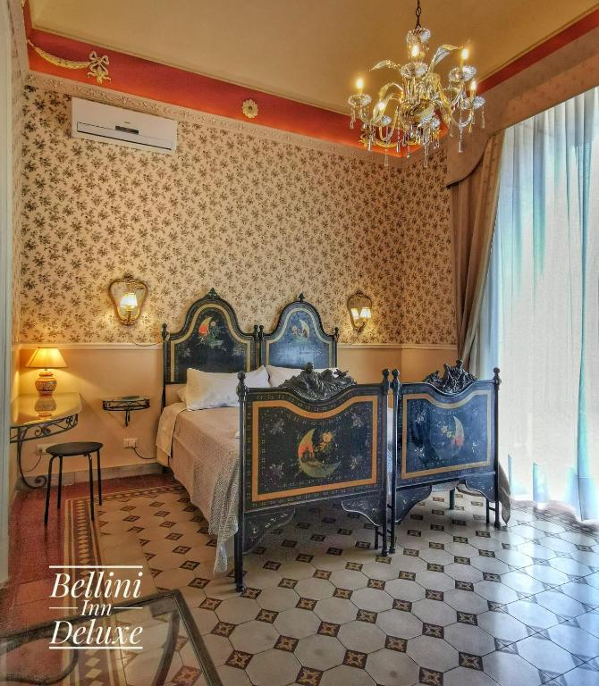 Postel nebo postele na pokoji v ubytování Bellini Inn Deluxe