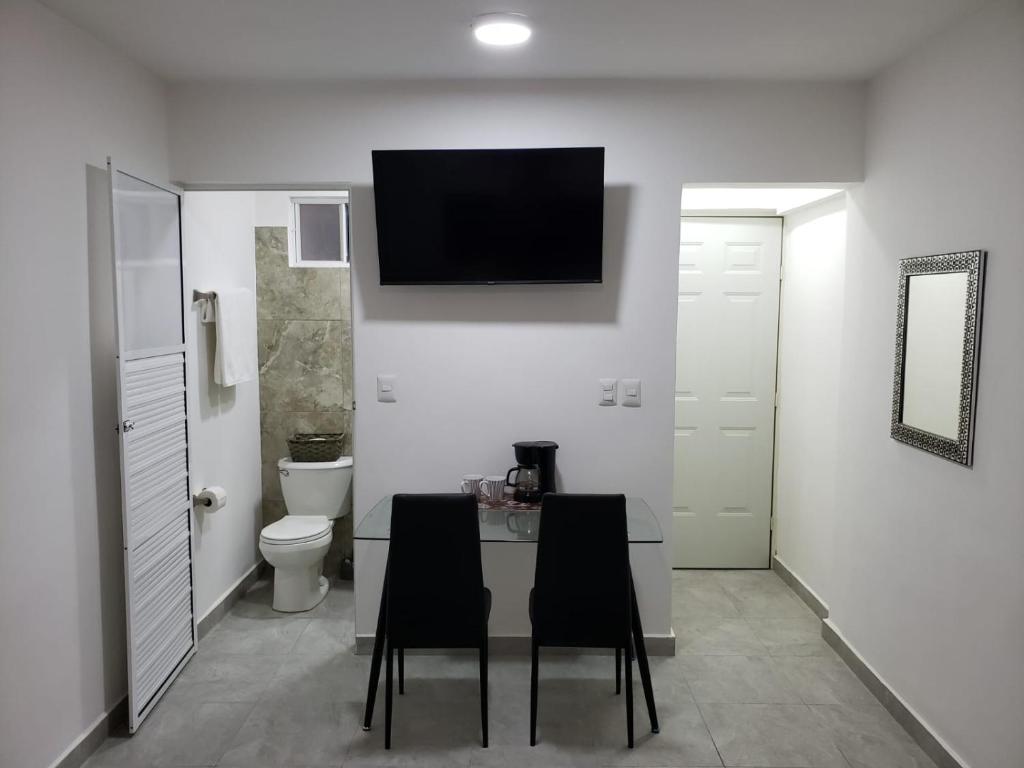 A television and/or entertainment centre at Casa Aura - Center Studio - 1st Floor