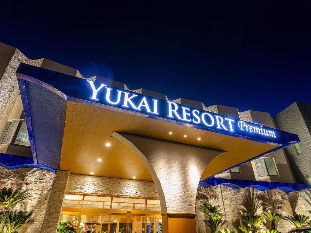 a building with a sign that reads yuc rental resort at Yukai Resort Premium Hotel Senjo in Shirahama