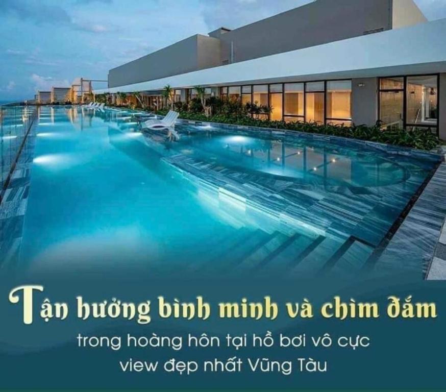 a large swimming pool in front of a building at The Song Vũng Tàu Luxury House in Vung Tau