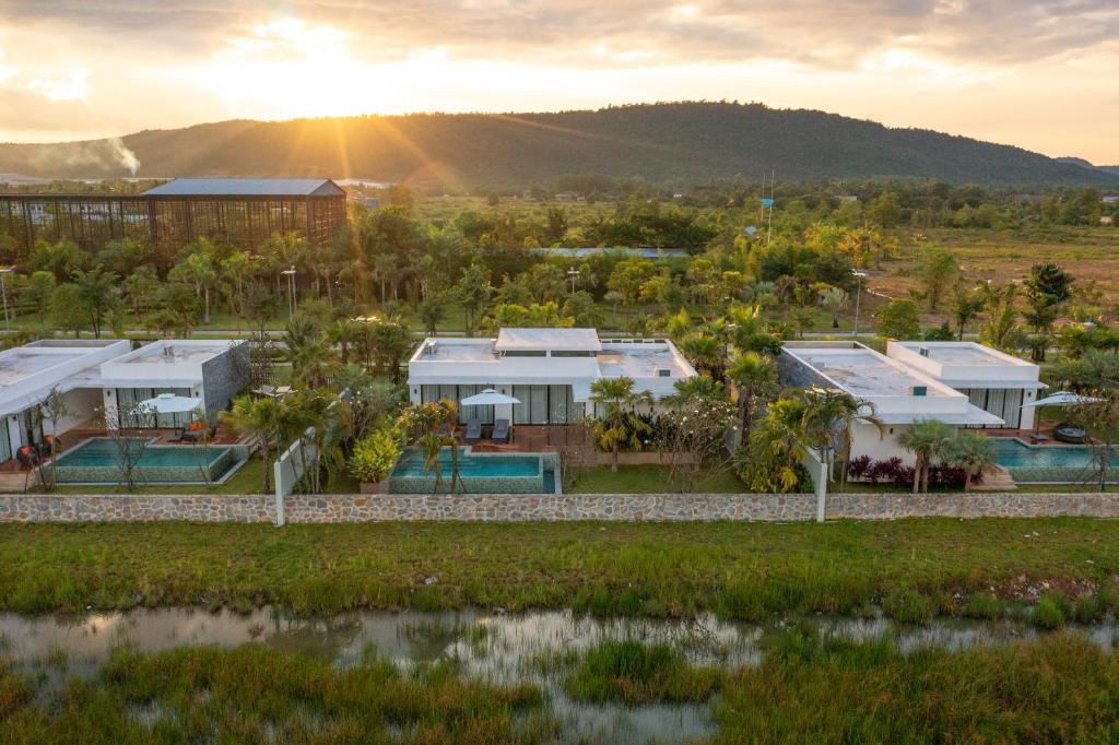 an aerial view of a resort with the sun setting at Wonderland Suites and Resort in Sihanoukville