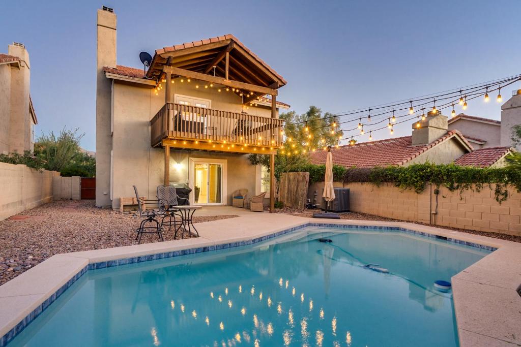 a swimming pool in front of a house at Desert Sage House, Pool, 75in TV, Kids Living Area in Tucson