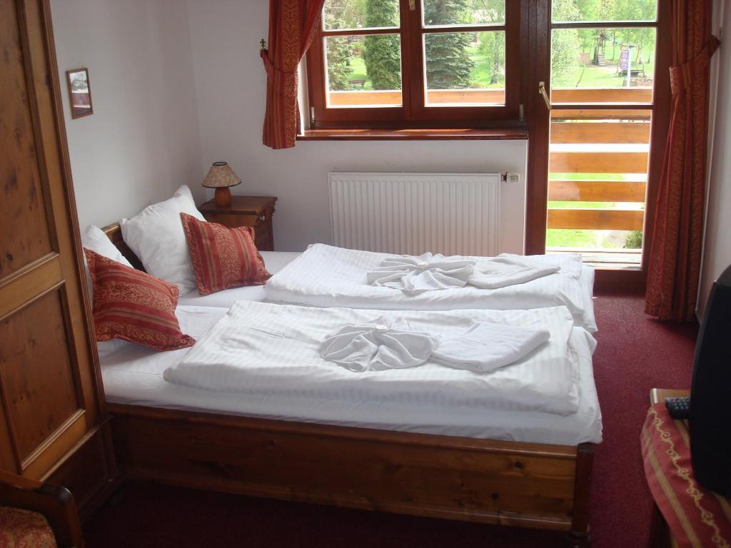 Łóżko lub łóżka w pokoju w obiekcie Sport hotel POMI