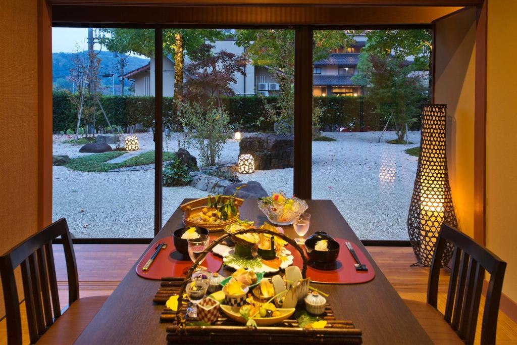 a table with a plate of food on it at Kanazawa Hyakurakusou in Kanazawa