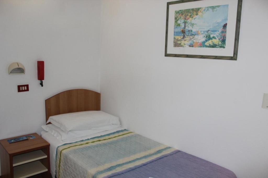 Postel nebo postele na pokoji v ubytování Hotel Santini