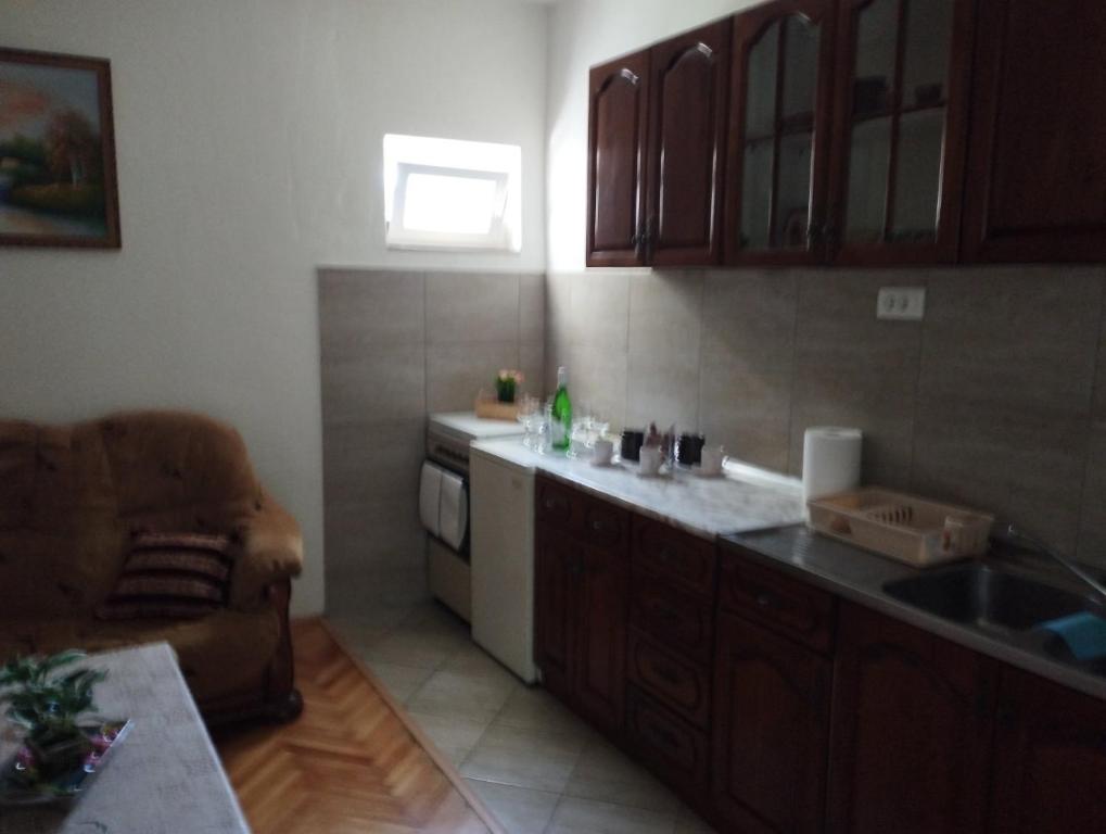 a kitchen with a sink and a counter top at Apartman Milicevic in Bileća