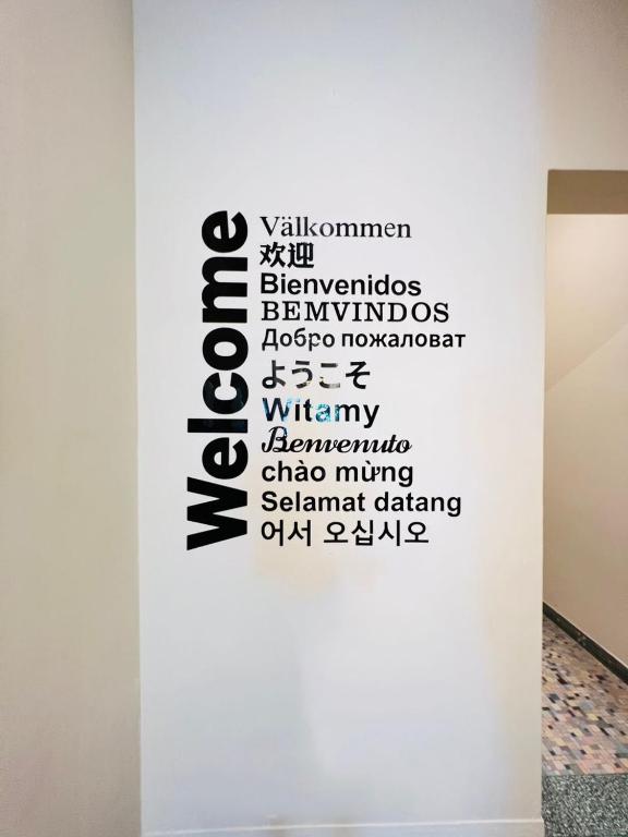 a white wall with a black sign on it at myROOM @ Mandalay Georgetown, Off Jln Burma, Gurney Drive in George Town