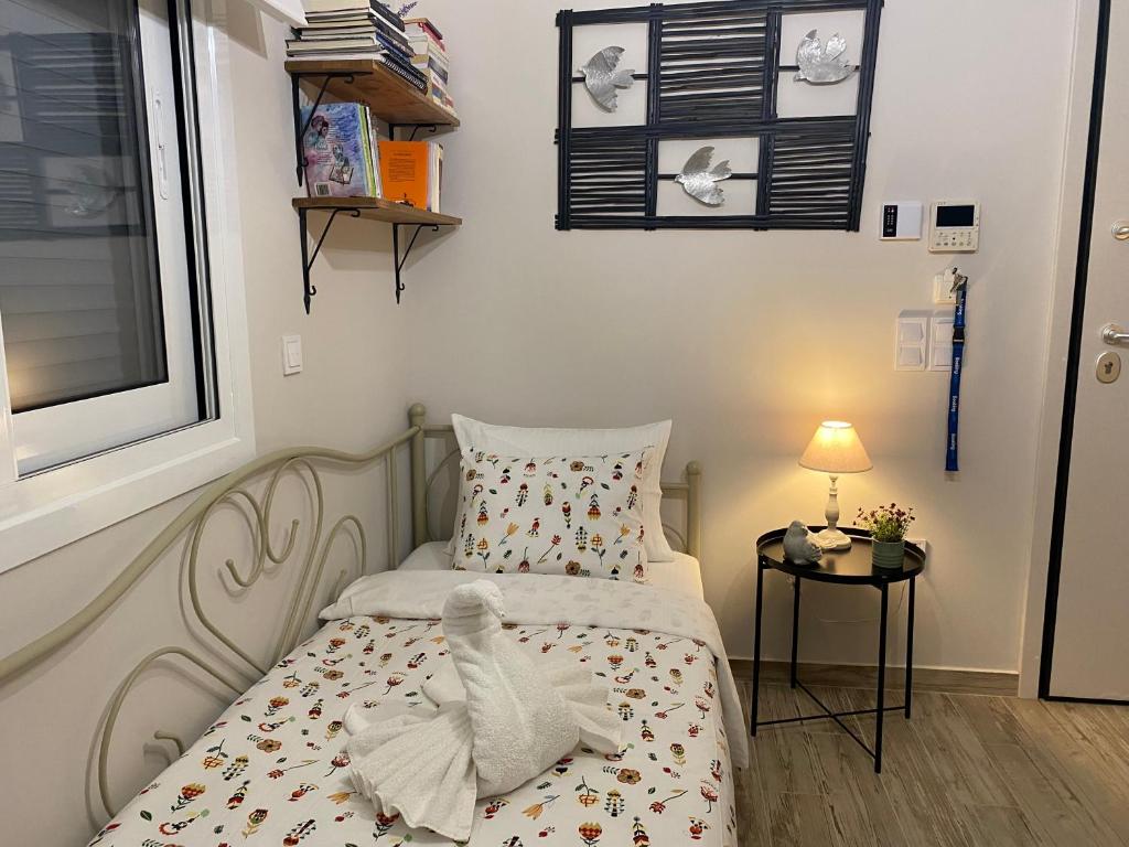 Postel nebo postele na pokoji v ubytování Philia Apartment