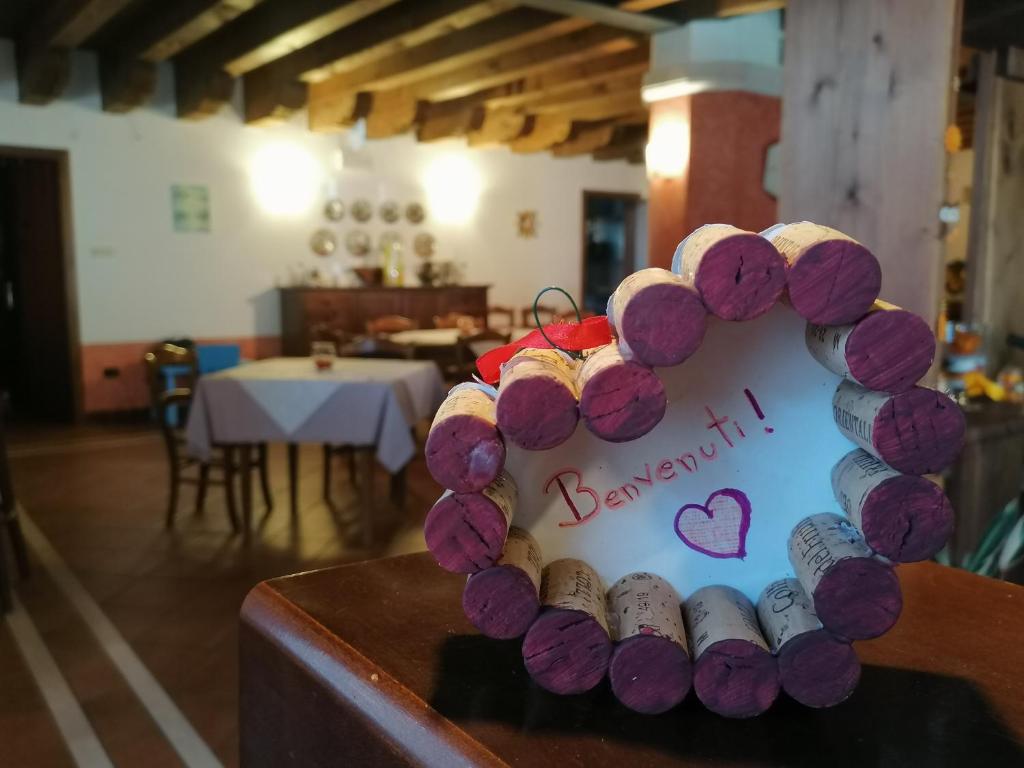 a sign with a heart made out of wine bottles at Agriturismo Il Salice Ridente in Pasiano di Pordenone