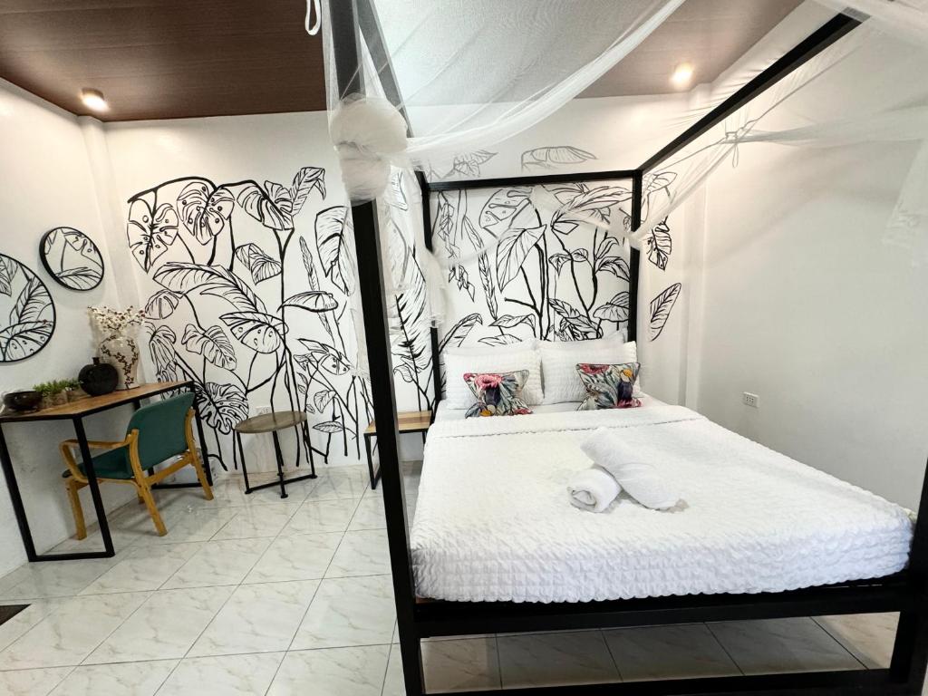 Postel nebo postele na pokoji v ubytování Mahajab Homestay SIARGAO