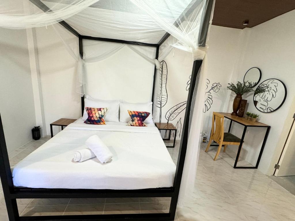 Postel nebo postele na pokoji v ubytování Mahajab Homestay SIARGAO