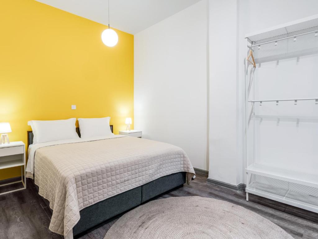 A bed or beds in a room at Kula apartments City center Exarchia