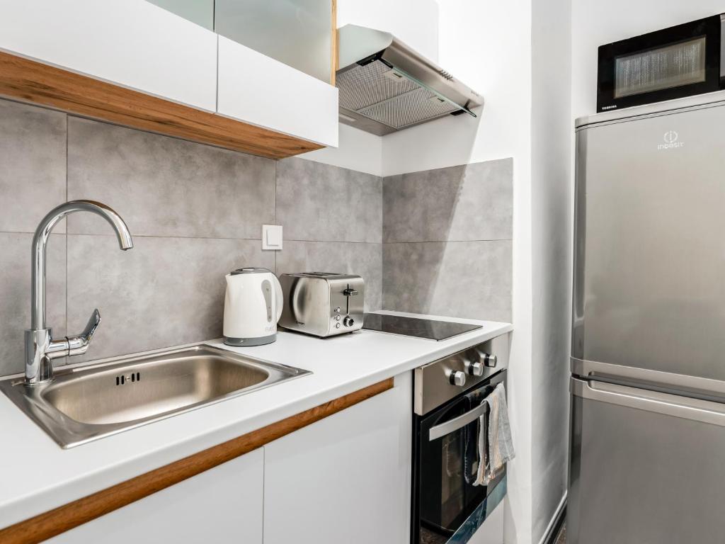 A kitchen or kitchenette at Kula apartments City center Exarchia