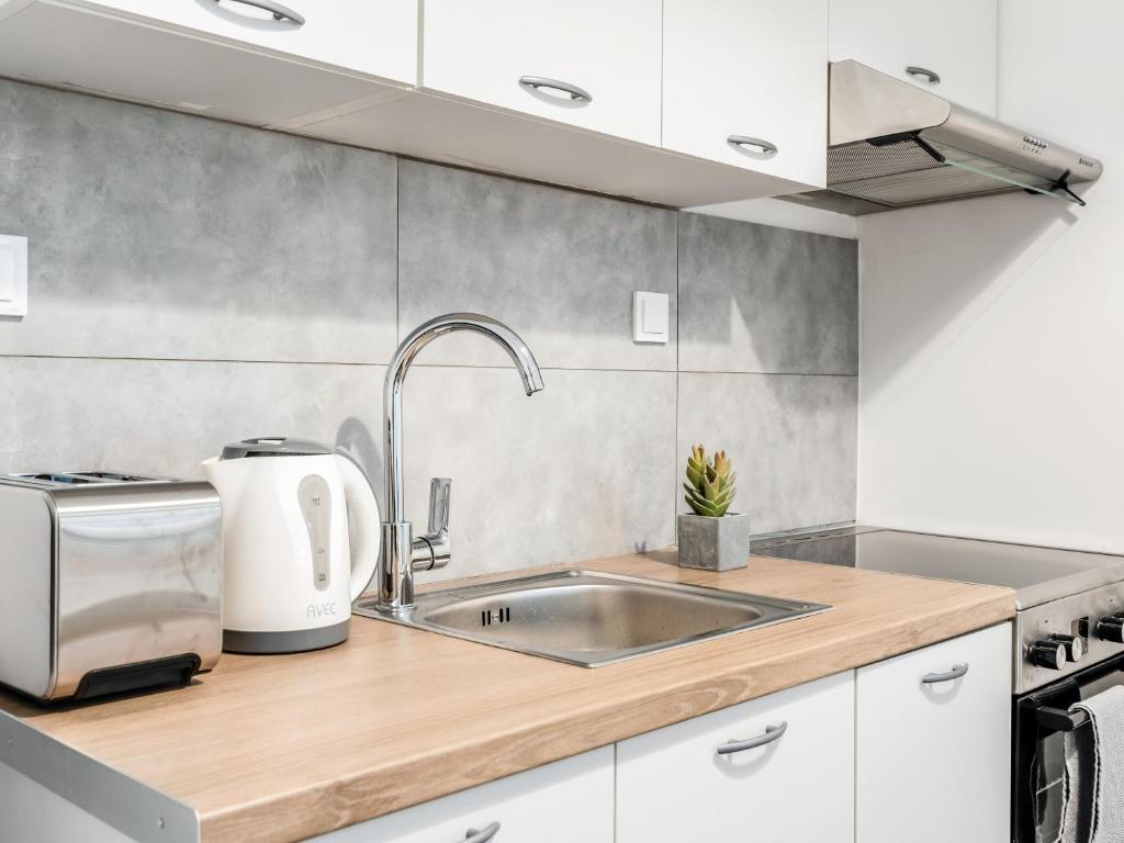 A kitchen or kitchenette at Kula apartments City center Exarchia