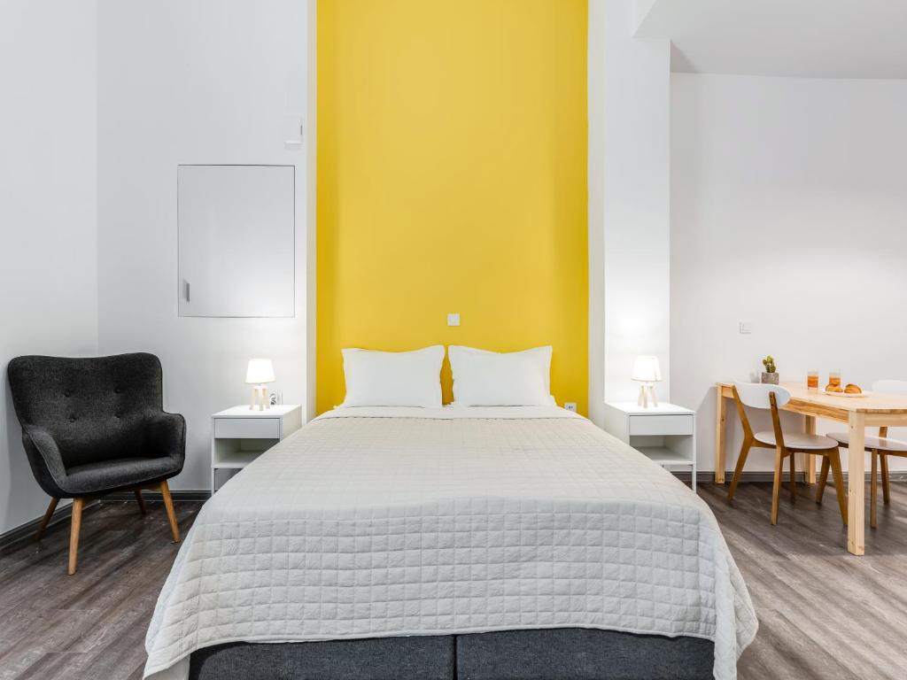 A bed or beds in a room at Kula apartments City center Exarchia