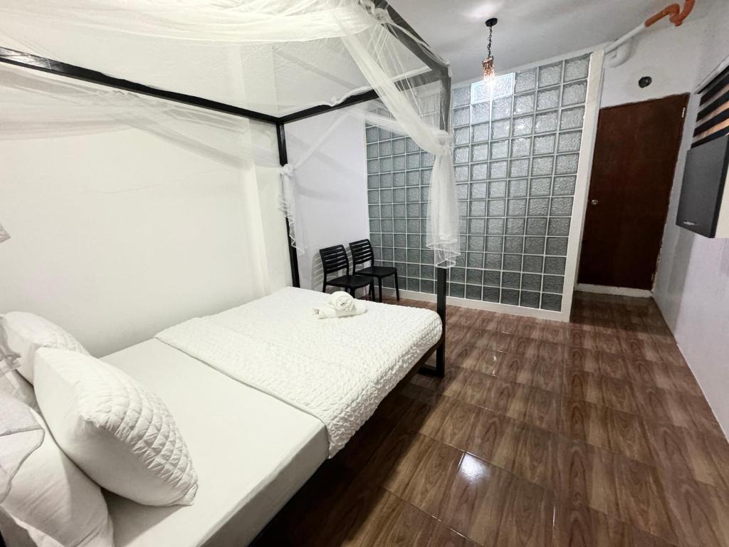 Postel nebo postele na pokoji v ubytování Mahajab Homestay SIARGAO