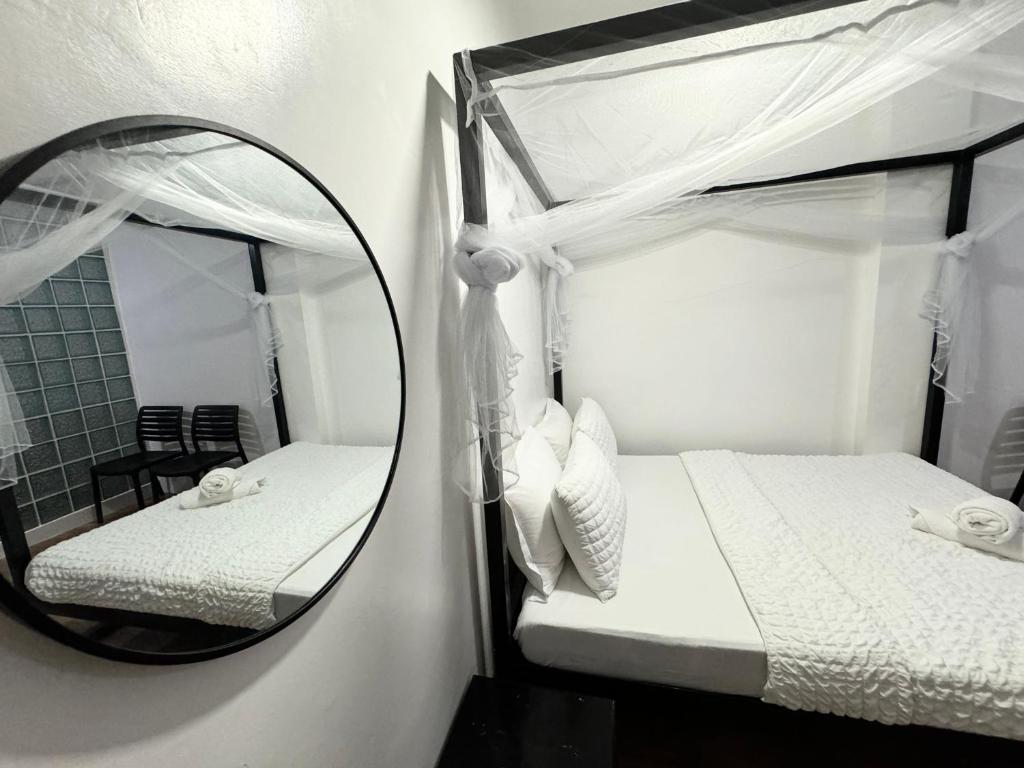 Postel nebo postele na pokoji v ubytování Mahajab Homestay SIARGAO