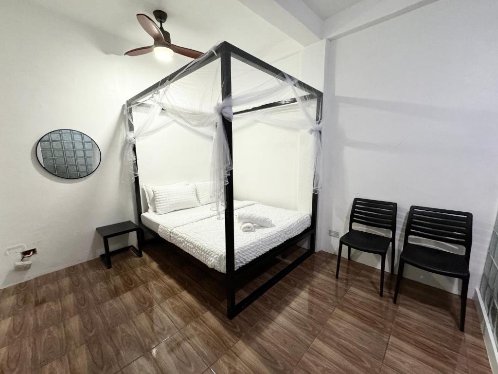 Postel nebo postele na pokoji v ubytování Mahajab Homestay SIARGAO