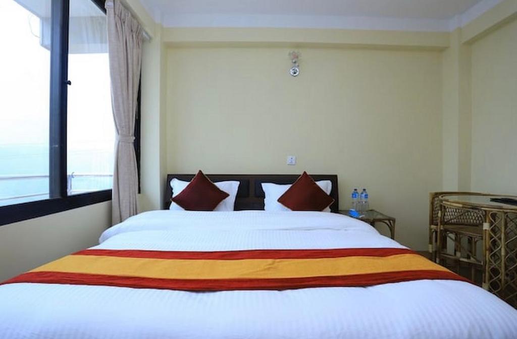 Postel nebo postele na pokoji v ubytování Hotel Bihani
