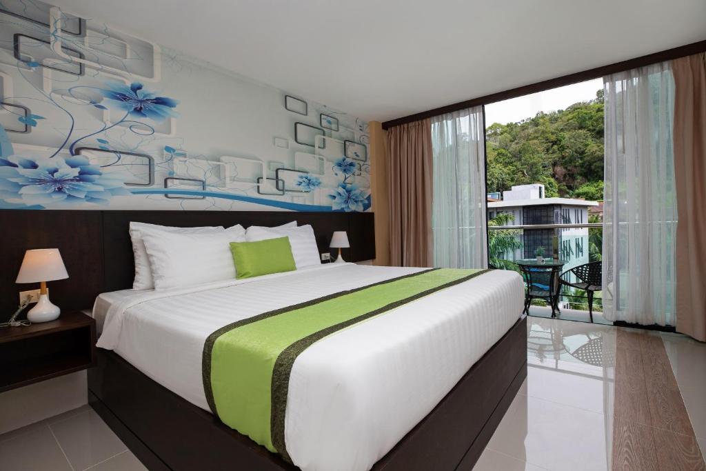Postel nebo postele na pokoji v ubytování iCheck inn Sky Beach Ao Nang Krabi
