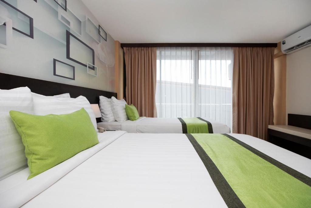 Postel nebo postele na pokoji v ubytování iCheck inn Sky Beach Ao Nang Krabi