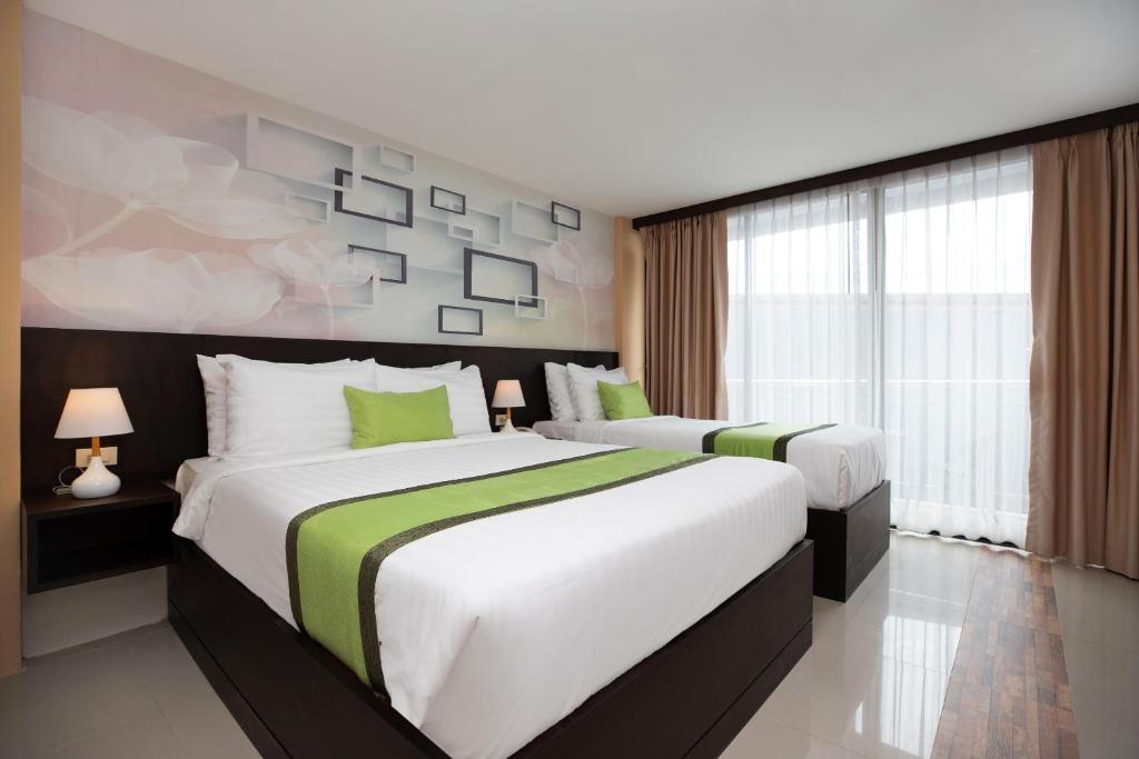 Postel nebo postele na pokoji v ubytování iCheck inn Sky Beach Ao Nang Krabi