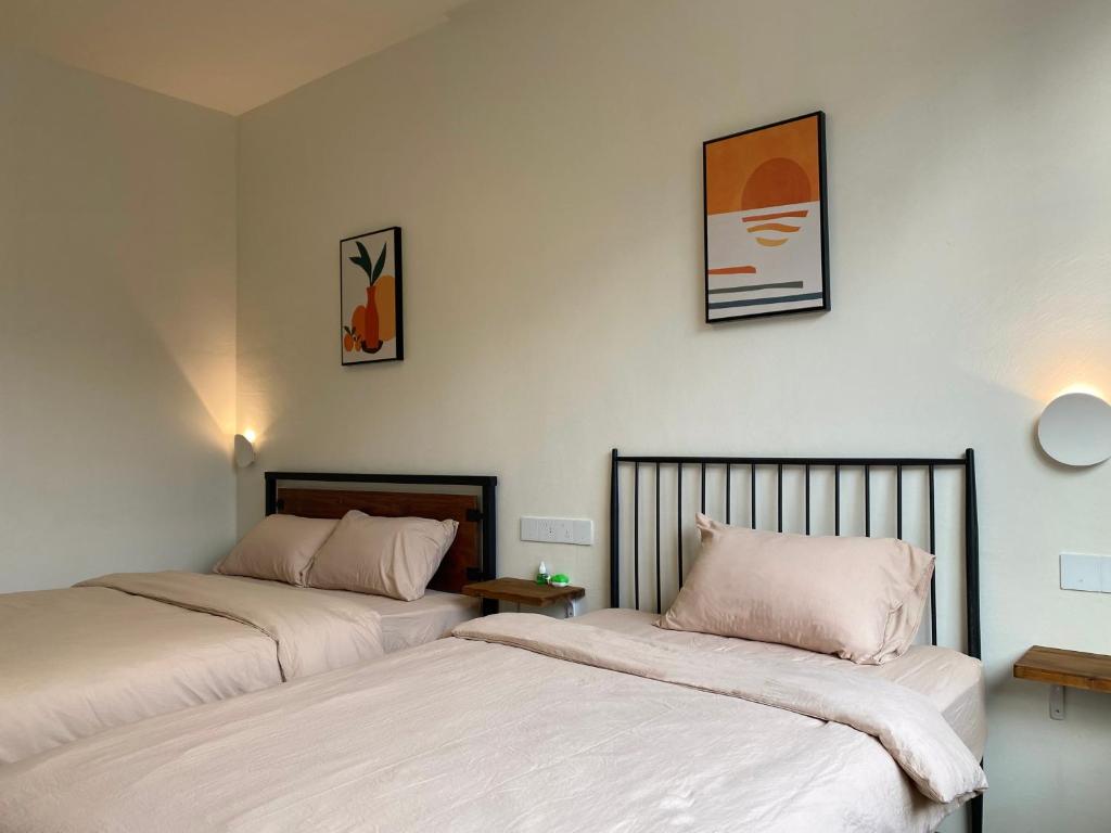 Postel nebo postele na pokoji v ubytování Pomelo Hostel Xingping