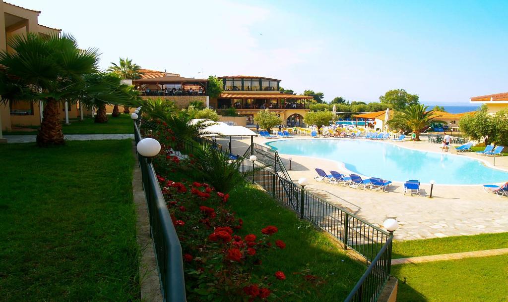 a resort with a swimming pool and a resort at Village Mare in Metamorfosi