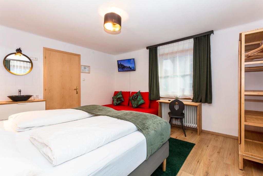 Postel nebo postele na pokoji v ubytování Sonnberg Lodge