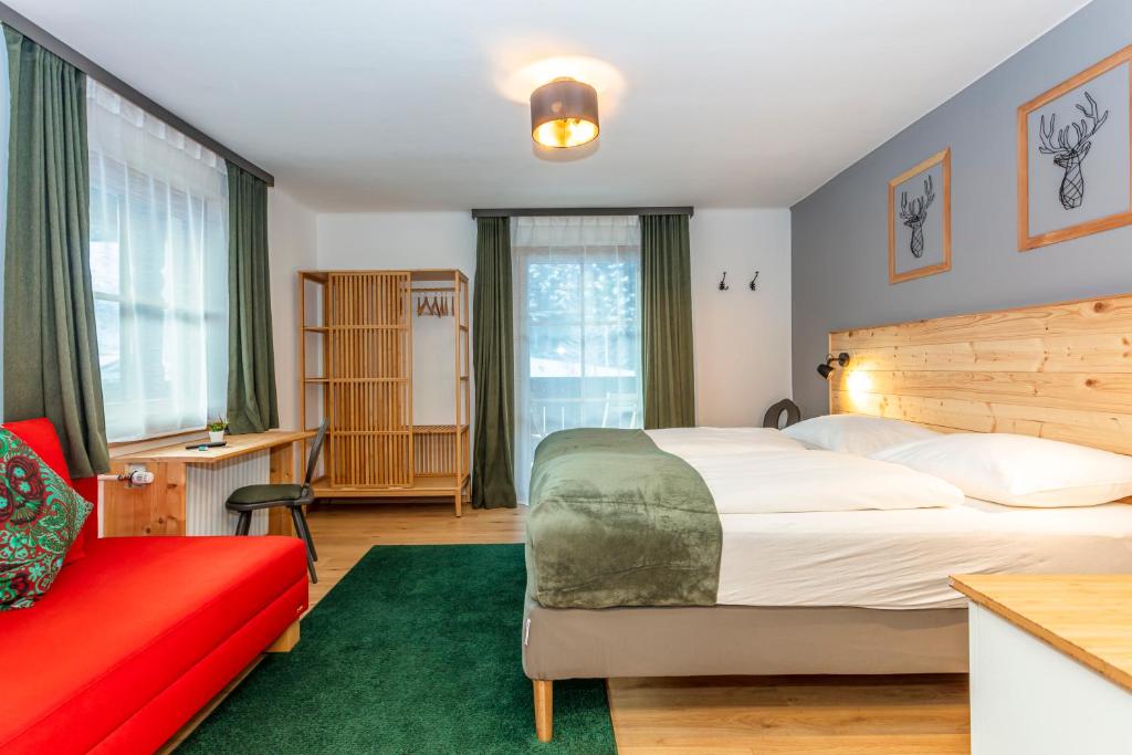 Postel nebo postele na pokoji v ubytování Sonnberg Lodge