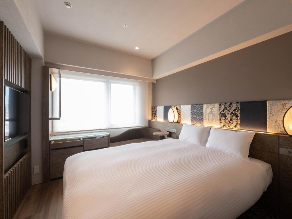 insomnia KYOTO OIKEにあるベッド