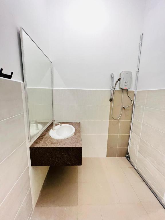 a bathroom with a sink and a shower at myROOM @ Mandalay Georgetown, Off Jln Burma, Gurney Drive in George Town