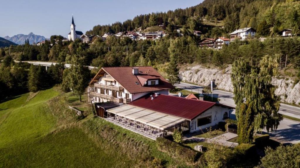 an aerial view of a house on a hill at Meilerhof in Reith bei Seefeld