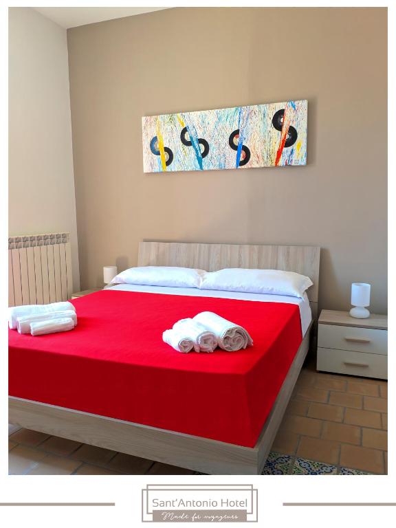 Postel nebo postele na pokoji v ubytování Sant'Antonio Hotel - Dimora Storica